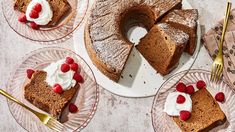 several slices of cake on plates with raspberries