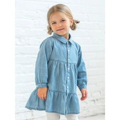 Dress your little lady for the season's festivities with our Roxy Chambray Shirt Dress. Perfect for fall outings, this tiered long-sleeve dress features a crisp collar, gathered waist, and ruffle hem for a timeless look during autumn days. Made of 100% Organic Chambray Fabric Recycled plastic buttons Infant diaper cover with elastic waist and leg opening Water-based dyes ensuring long-lasting color vibrancy and durability Sustainably sourced and ethically produced Naturally hypoallergenic Machin Fall Outings, Itzy Ritzy, Chambray Shirt Dress, Chambray Fabric, Autumn Days, Baby Swimming, Baby Swaddle, Diaper Cover, Chambray Shirt