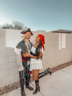 a man and woman dressed up as pirates