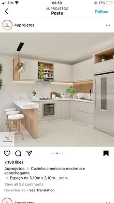 an image of a kitchen with white cabinets and marble counter tops on the bottom right hand corner