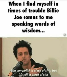 a man speaking into a microphone in front of a sign that reads, when i find myself in times of trouble billie joe comes to me speaking words of wisdom