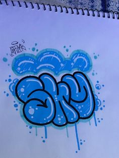 graffiti written in blue ink on white paper