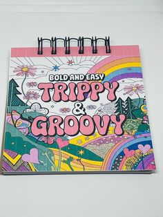 a spiral notebook with the title bold and easy trippy & grooy on it