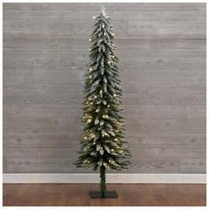 Tree Number: 21 Lights: 105 White LED Lights Number Of Tips: 289 Number Of Sections: 2 Stand: Square Metal Decor: Flocking Safety: Flame Retardant Dimensions: Width: 20" Height: 5 Feet Stand Length: 9" Stand Width: 9" Stand Height: 0.5" Box Length: 32.5" Box Width: 6.75" Box Height: 7.25" Weight: 7.95lbs Have a blast with your dearest friends and family as you rock around this Flocked Alpine Pre-Lit Christmas Tree! This faux tree's slender profile makes it perfect for any narrow or odd-shaped sp