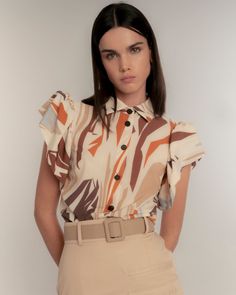 Immerse yourself in the wild essence of the Savannah with our Straight Shirt with Puffed Sleeves and Safari Print. This garment merges the authenticity of ethnic fabrics with a palette of earth and terracotta tones, enhanced with touches of lime orange. The puffed sleeves achieve a perfect balance between the wild and the sophisticated. Lapel collar and short sleeve shirt with ruching. Interior yoke detail on the sleeve to add volume. Front button closure. Side slits. Abstract safari print in ca Unique Meaning, Safari Print, Shirt Blouses Women's, Puffed Sleeves, Mens Jewelry Bracelet, In The Wild, Independent Designers Fashion, Lapel Collar, Badger