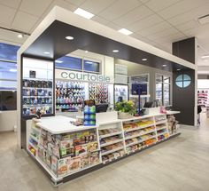 the inside of a grocery store filled with lots of food and drink bottles on display