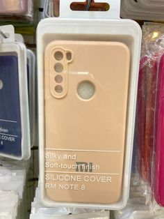 the back of a cell phone case is shown in its packaging, next to other cases