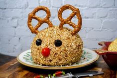 a cake with pretzels on it and a face made to look like a reindeer