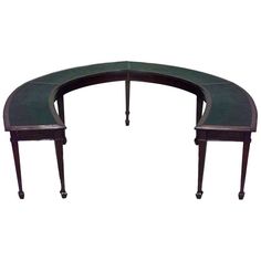 an oval shaped table with two benches on each side