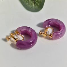 These minimalist lightweight, purple screw back clip-on hoop earrings are simple yet perfect huggie hoop for your everyday look. SIZE:2.3 cm Purple Hoop Earrings For Pierced Ears, Purple Small Hoop Earrings For Pierced Ears, Small Purple Hoop Earrings For Pierced Ears, Hypoallergenic Purple Hoop Earrings, Purple Clip-on Earrings, Piercing Earrings, Huggie Earrings, Delicate Earrings, Large Earrings