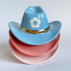 colorful ceramic cowboy hat decor with a flower accent and 22k gold band Clay Cowgirl Hat, Clay Cowboy Hat, Cowboy Hat Ashtray, Cowboy Hat Ceramic, Cowboy Boot Ceramic Vase, Blue Harvest, Colorful Ceramics, Country Charm, Boy Blue