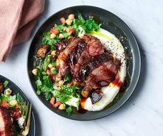 two black plates with food on them next to each other