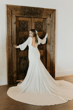 Perfect for vintage-loving brides, this sleek crepe gown channels iconic 70s bridal fashion. Featuring a dramatic deep V-neckline and flowy chiffon sleeves, it's a dreamy blend of retro romance and modern elegance. #VintageBride #70sWedding #BohoBridal #RetroRomance