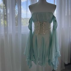 Pls Send Measurements To Reference If Interested! Fits Around A Size Small This Piece Was Custom Made For Me. The Corset Had To Be Adjusted To Fit Properly, In The Pics On The Front There’s A Very Imperfection In The Bust Area W The Silk. I Wear This Dress Only Once In The Maldives It Doesn’t Fit Me Anymore And I Hope It Can Find A New Home With Someone That Will Appreciate It As Much As I Did Ps Apologies I Do Not Have A Steamer Atm So This Dress So It’s A Bit Wrinkled Fitted Vintage Fairy Dress For Spring, Fitted Light Blue Dress With Lace Trim, Light Blue Bohemian Dress With Lace Trim, Fitted Long Sleeve Fairy Dress For Summer, Fitted Bohemian Light Blue Mini Dress, Bohemian Fitted Light Blue Mini Dress, Light Blue Bohemian Dress For Wedding, Light Blue Bohemian Wedding Dress, Fitted Blue Bohemian Vintage Dress