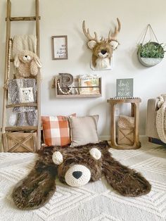 a room with stuffed animals and other items on the wall, including a teddy bear rug