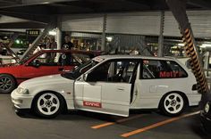 several cars are parked in a parking garage