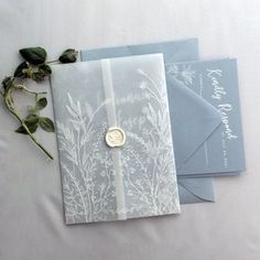 three wedding cards with wax stamp on them