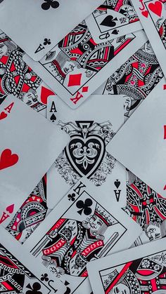 several playing cards are arranged in the shape of a heart, spades and hearts