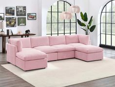 a living room with a large pink sectional couch