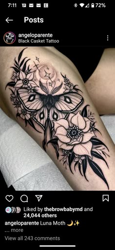 a black and white tattoo with flowers on it