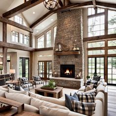 a living room filled with lots of furniture and a fire place in the middle of it