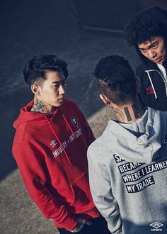 three young men standing next to each other