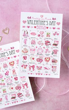 two valentine's day printables are sitting next to each other on a pink surface