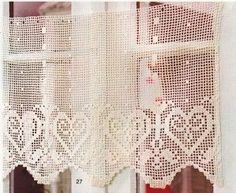 the curtain is made from white crochet