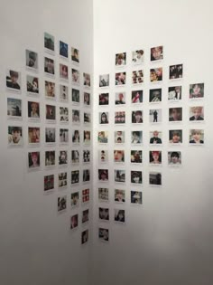 a wall with many pictures hanging on it's side and the walls are covered in photos