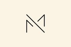 the letter m is made up of thin lines and black letters on a white background