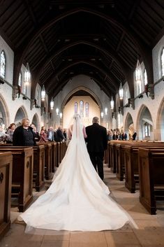 the bride and groom are walking down the aisle