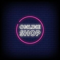 a neon sign that says online shop in the middle of a dark brick wall background