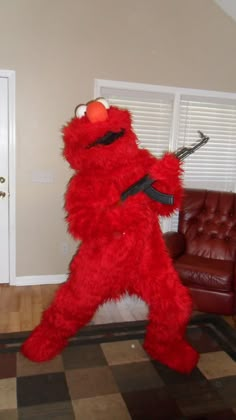 a large red stuffed animal standing in the living room