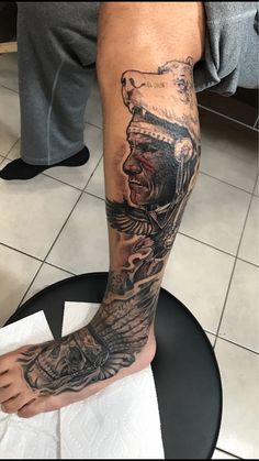 a man with a tattoo on his leg