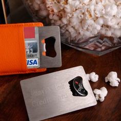 there is popcorn and a credit card on the table