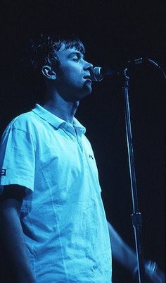 a man standing in front of a microphone