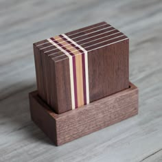 a small wooden block with stripes on it