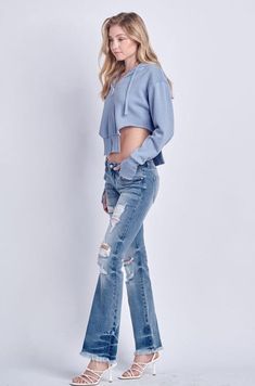 Details Style No. AT1029BTM Elevate your denim collection with Low Rise Stretch Distressed Bootcut Jeans – a fusion of comfort, style, and edgy design that adds a unique touch to your ensemble. Highlights Super Stretchy Denim Comfort High-Quality Material Distressed Detail Low Rise Chic Natural Frayed Hem Medium Stone Wash Shape & fit Bootcut Low rise Frayed Hem Specifications: Front Rise: 8 inches Inseam: 32 ½ inches Leg Opening: 19 inches Model Details: MODEL IS 5' 9" WEARING SIZE 26 Trendy Fall Flare Jeans With Frayed Hem, Distressed Cutoff Flare Jeans For Fall, Edgy Ripped Flare Jeans For Fall, Distressed Relaxed Fit Flare Jeans For Fall, Trendy Distressed Flare Jeans, Relaxed Fit Distressed Flare Jeans For Fall, Trendy Ripped Flare Jeans For Fall, Edgy Denim Blue Flare Jeans For Fall, Distressed Stretch Flare Jeans In Cotton