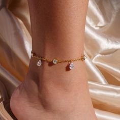 A diamond-inspired anklet featuring multi cubic zirconia stones is a stunning gift for her! The sparkling crystals create a chic, elegant look, perfect for adding a touch of glamour to any outfit. #YOU MAY LIKE THIS Pearl cubic anklet https://www.etsy.com/listing/1537471356/pearl-cubic-anklet-double-layered Pearl cubic fancy anklet https://www.etsy.com/listing/1567993735/pearl-cubic-fancy-anklet-party-anklets # SPECIFICATION Material: 16K Plated Jewelry Color: Gold Chain length: 10.5" Please contact us if you need to change chain length. # CARE INSTRUCTION Keep away from the water and soap to maintain good condition! Double Chain Bracelet Gold, Elegant Party Anklets With Bling, Elegant Bling Anklets For Party, Elegant Crystal Anklets With Adjustable Fit, Adjustable Crystal Anklets In Elegant Style, Elegant Gold Crystal Anklets, Dangle Anklets For Parties, Elegant Crystal Anklets For Gifts, Silver Cubic Zirconia Anklets For Gift