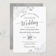 a wedding card with silver foil on the front and white paper on the back, featuring an elegant floral design