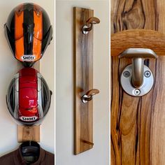 three different types of motorcycle helmets mounted to wooden boards and hooks on the wall next to each other