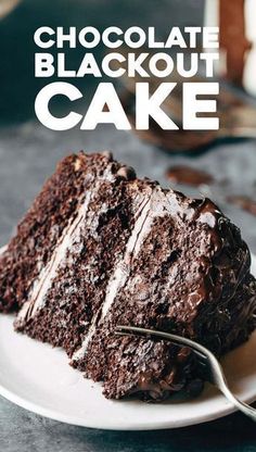 a close up of a piece of cake on a plate with the words chocolate blackoute out cake