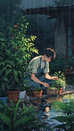 a man kneeling down in front of a pond filled with plants