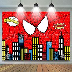 an empty room with three spotlights on the wall and a spider - man mural