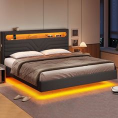 a bedroom with a large bed and orange lights