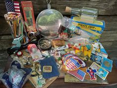 a table topped with lots of assorted items next to each other on top of a wooden table