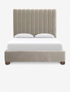 a bed with an upholstered headboard and foot board