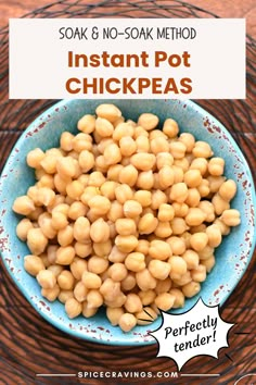 a blue bowl filled with instant pot chickpeas on top of a wooden table