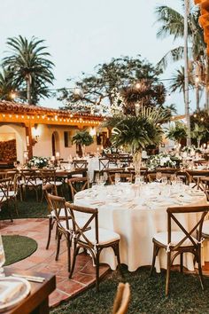 an outdoor dining area with tables and chairs set up for a formal function at the resort