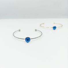 Evil eye bangle bracelet is adjustable. There is one evil eye bead on the evil eye bracelet. Evil eyes are believed to protect the person who carries them. They are also believed to bring good luck and deflect the negative energy. Charm Evil eye bangle can be a perfect gift choice for Christmas or birthday. Blue eye bracelet is also great for daily wear or special occasions. Tarnish resistant, can't be faded in along time. For more evil eye bracelets, click the link below; https://www.etsy.com/s Adjustable Round Evil Eye Bracelet, Adjustable Metal Evil Eye Jewelry, Metal Evil Eye Bangle Bracelet Gift, Adjustable Blue Evil Eye Bangle Bracelet, Adjustable Blue Evil Eye Bracelet, Nickel Free, Adjustable Blue Evil Eye Bracelet Nickel Free, Adjustable Nickel-free Blue Evil Eye Bracelet, Blue Resizable Evil Eye Bracelet, Evil Eye Beaded Bangle Bracelet